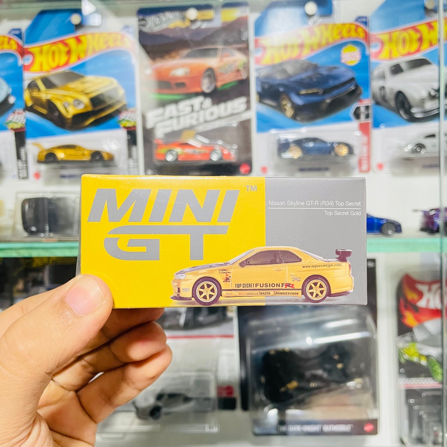 Mini GT, Nissan Skyline GT-R (34) Top Secret Gold